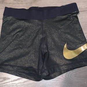 Black and gold Nike shorts